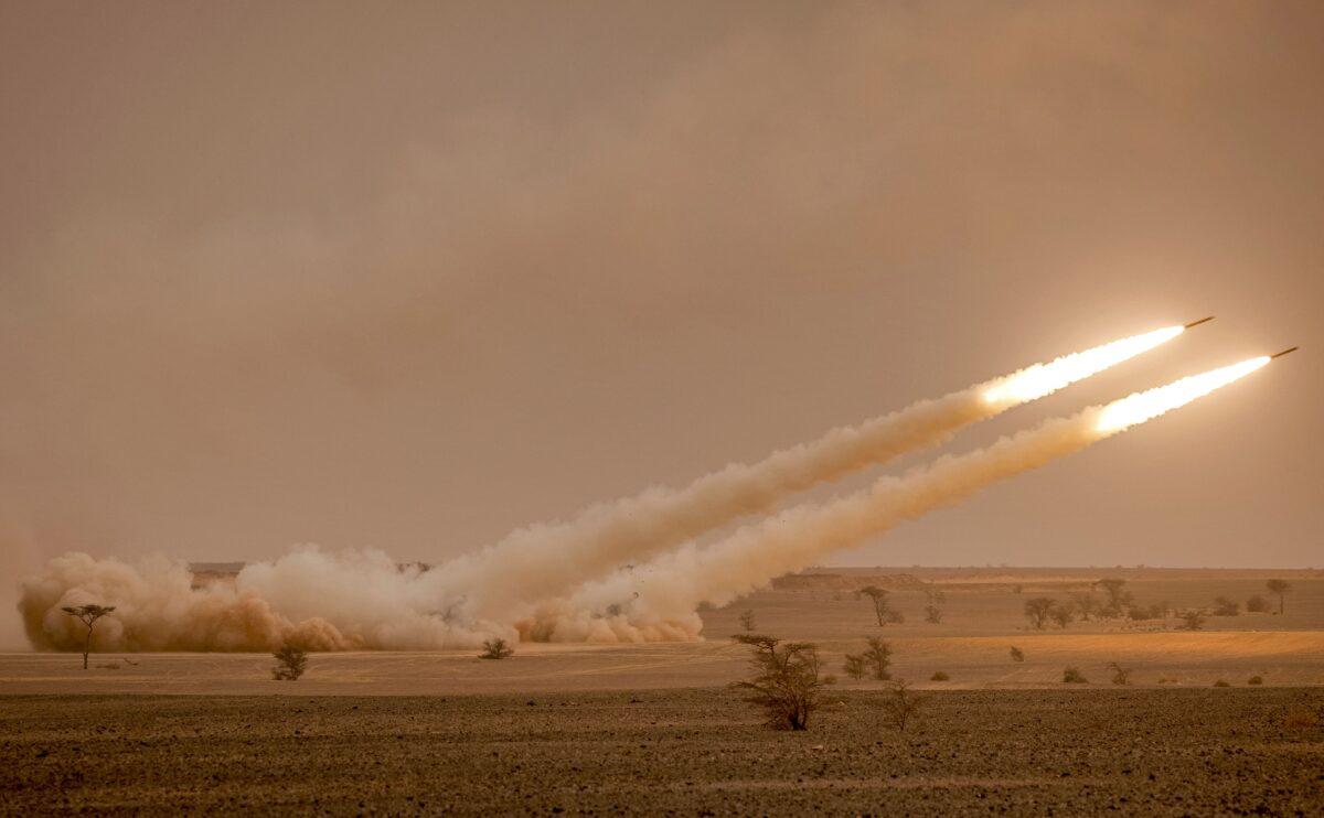 U.S. M142 High Mobility Artillery Rocket System (HIMARS) launchers fire salvoes during the "African Lion" military exercise in the Grier Labouihi region in southeastern Morocco on June 9, 2021. (Fadel Senna/AFP via Getty Images)