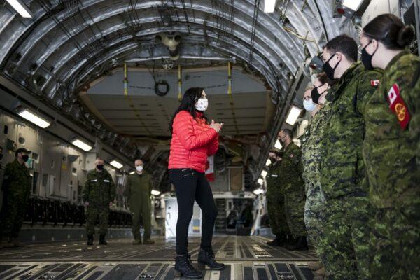 Defence Minister Anita Anand speaks to military personnel after getting a tour of the CC 177 Globemaster aircraft at Canadian Forces Base Trenton, in Trenton, Ont., April 14, 2022. (The Canadian Press/Christopher Katsarov)