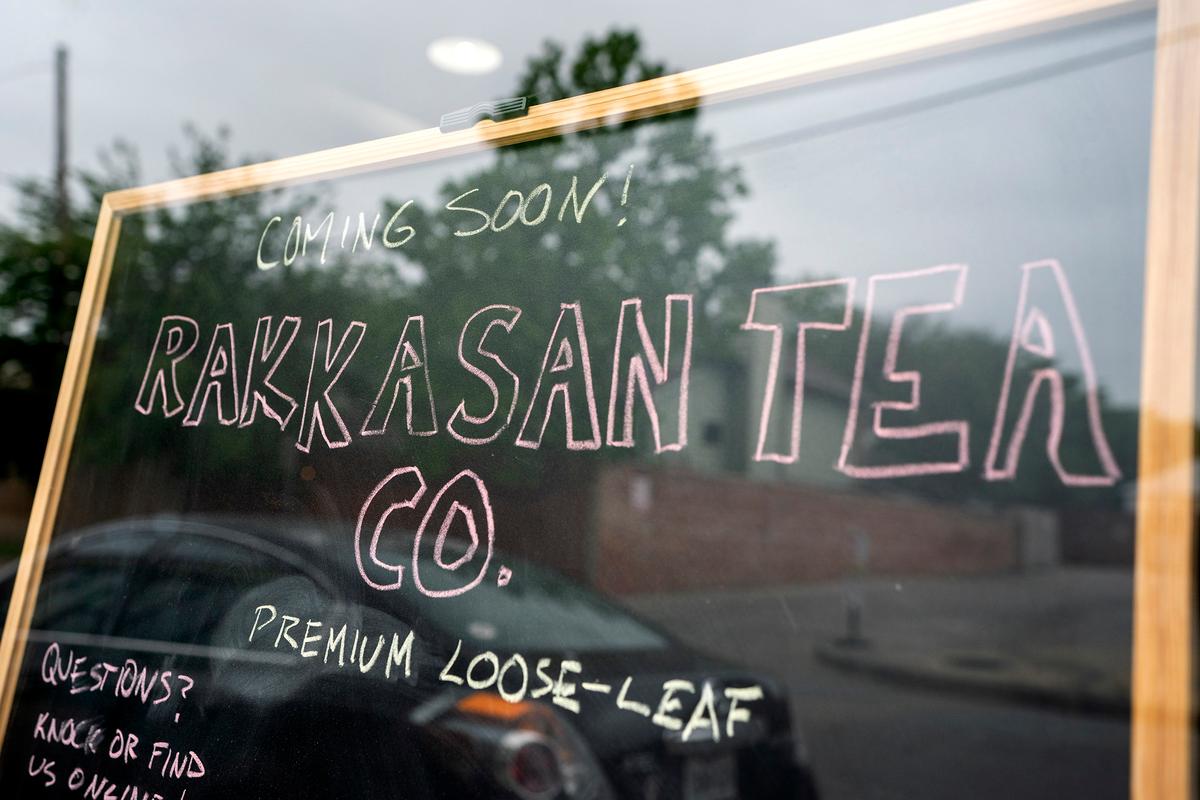 A sign in the front window announces the opening of Rakkasan Tea's new brick-and-mortar storefront Friday, April 23, 2021, in Dallas. After gaining an appreciation for tea while serving in Afghanistan and Iraq, Kamauf and fellow US Army veteran Brandon Friedman started Rakkasan Tea in 2017 to sell loose-leaf tea sourced from post-conflict countries. (Jeffrey McWhorter/Dallas Morning News/TNS)