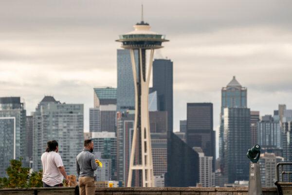 People take in a view of the skyline, as Seattle has become the first major city to reach a 70 percent COVID-19 vaccination rate in Seattle, Washington on June 10, 2021. (David Ryder/Getty Images)