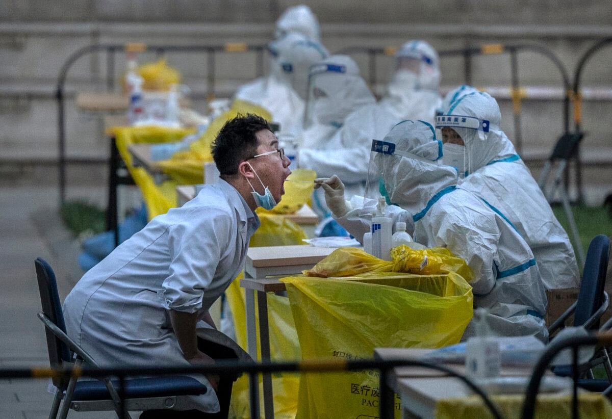 Chinese City Conducts Nucleic Acid Test as WHO Lifts COVID Health Emergency