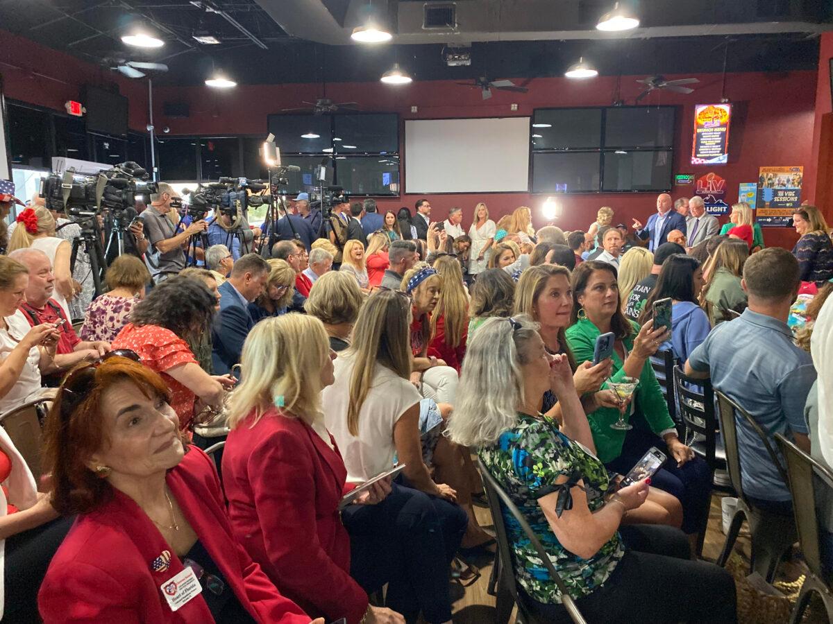 There's standing room only as a packed house awaits the arrival of Florida Gov. Ron DeSantis for a press conference in Spring Hill, Fla., on April 25, 2022. (Patricia Tolson/The Epoch Times)