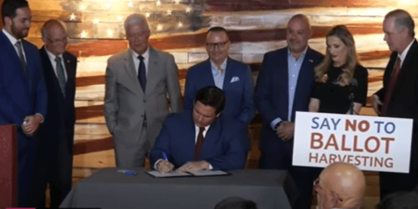 At an April 25, 2022 press conference in Spring Hill, Florida, Florida's Gov. Ron DeSantis signs bill into law that establishes the nation's first Office of Election Crimes and Security at the Department of State specifically to investigate voter fraud. (Patricia Tolson/The Epoch Times)