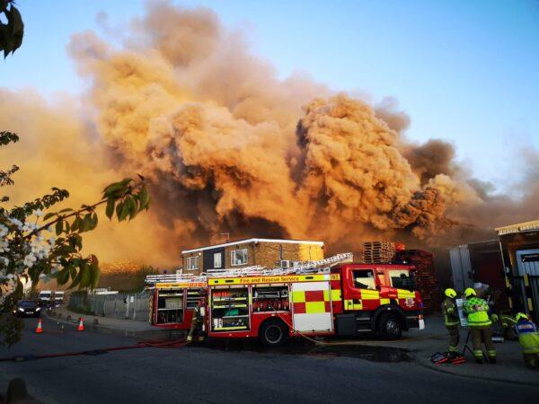Firefighters battling a blaze in an industrial building on River Way, Harlow, England, on Apr. 26, 2022. (Dorottya Spányik/PA Media)
