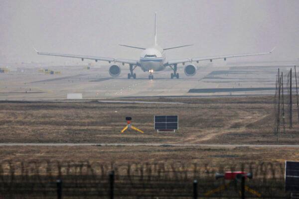 An airplane takes off at the Beijing Capital International Airport on March 23, 2022. (Tingshu Wang/Reuters)