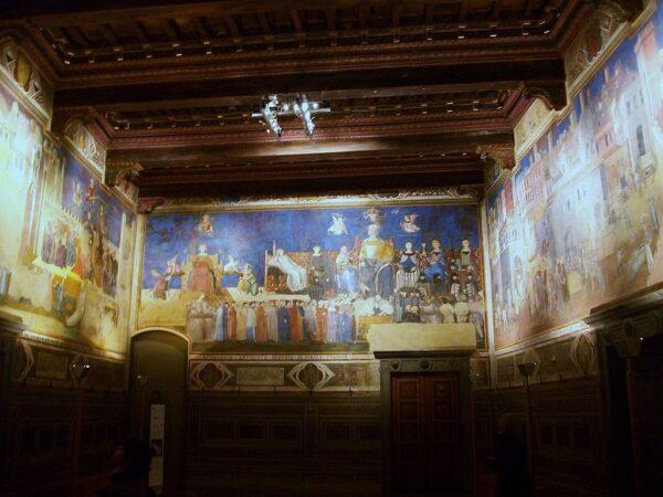 Council room in Siena town hall with frescoes on the walls, 1338–40, by Ambrogio Lorenzetti. Siena, Italy. (Public Domain)