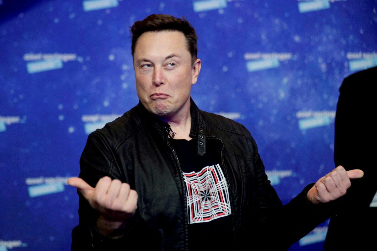 SpaceX owner and Tesla CEO Elon Musk grimaces after arriving on the red carpet for the Axel Springer award in Berlin, Germany, on Dec. 1, 2020. (Hannibal Hanschke/Reuters)