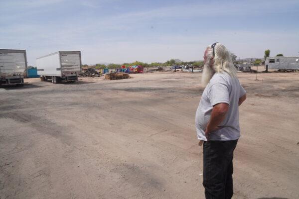 Maricopa Food Pantry CEO Jim Shoaf surveys the burn site on April 26. (Allan Stein/The Epoch Times)