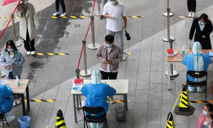 Chinese Cities Tighten Anti-Virus Curbs Amid Outbreak