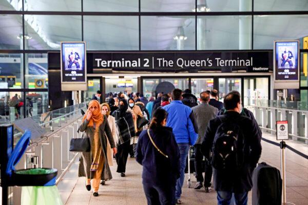 People queue to enter terminal 2, at Heathrow Airport, London, on Jan. 18, 2021. (Henry Nicholls/Reuters)