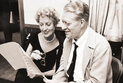 Jeanette MacDonald and Nelson Eddy reviewing sheet music in the recording studio in the late 1950s. (Public Domain)
