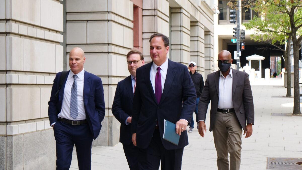 Michael Sussmann (C) arrives for a court hearing at a federal courthouse in Washington on April 27, 2022. (Oliver Trey/The Epoch Times)