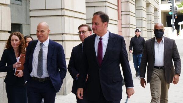 Michael Sussman (C) arrives for a court hearing at a federal courthouse in Washington on April 27, 2022. (Oliver Trey/The Epoch Times)