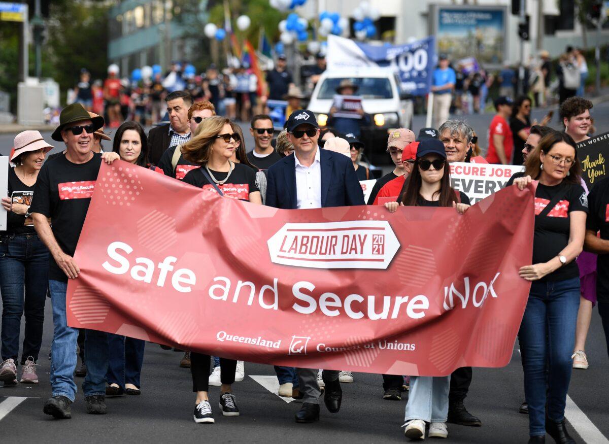 Prime Minister Anthony Albanese (centre) and Australian Council of Trade Unions President Michele O'Neil (4th left) take part in the 2021 Labour Day March in Brisbane, Australia, on May 3, 2021. (AAP Image/Dan Peled)