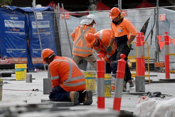 Construction workers are seen in Sydney, Australia, on Dec. 1, 2021. (Bianca De Marchi/AAP Image)