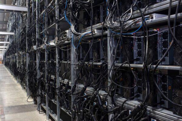 Bitcoin mining machines in a warehouse at the Whinstone US Bitcoin mining facility in Rockdale, Texas, on Oct. 10, 2021. (Mark Felix/AFP/Getty Images/TNS)