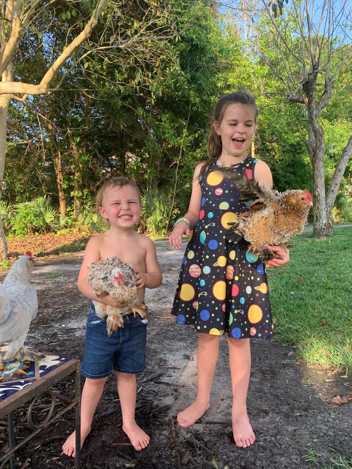 Lexi Smith's children hold their favorite pet chickens. Emmett, 3, has an ornamental breed called a calico princess. Madilyn, 9, holds the equally beautiful breed called a frizzle. (Courtesy of Lexi Smith)