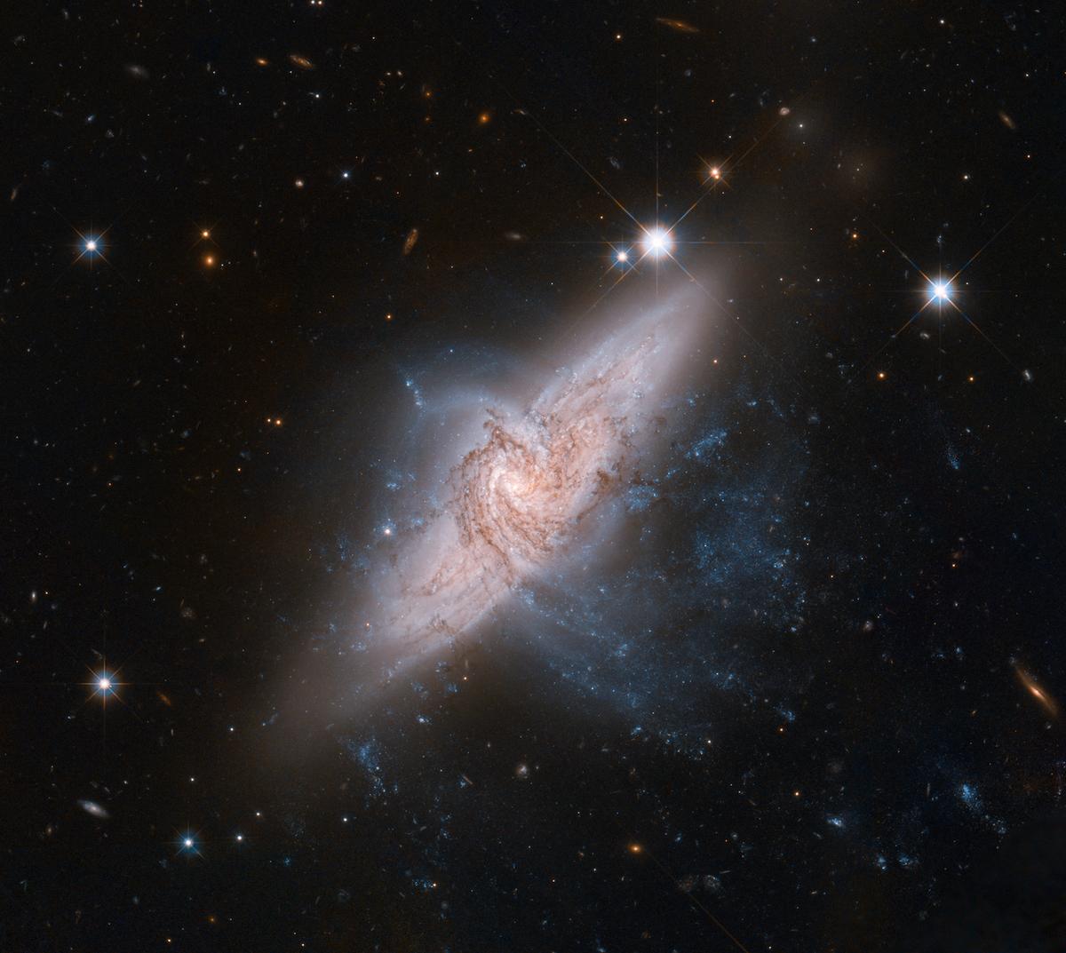 The NASA/ESA Hubble Space Telescope in June 2012 produced an incredibly detailed image of a pair of overlapping galaxies called NGC 3314, which although appearing to collide are actually tens of millions of light-years apart. (Courtesy of NASA, ESA, the Hubble Heritage (STScI/AURA)-<a href="https://esahubble.org/images/heic1208a/">ESA/Hubble Collaboration</a>, and W. Keel (University of Alabama)/CC BY 4.0)