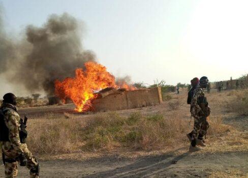 Multinational troops set fire to shelters used by Boko Haram terrorists on March 30 on the southern shore of Lake Chad. (Courtesy of Col. Muhammed Dole)