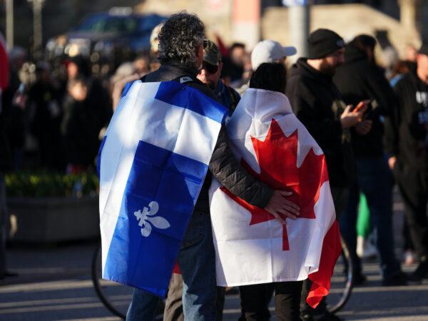 Protesters wearing Quebec and Canadian flags during a demonstration in Ottawa on April 29, 2022. (The Canadian Press/Sean Kilpatrick)