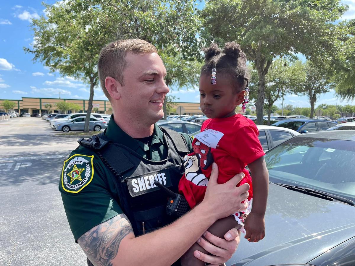 Deputy William Puzynski reunites with the baby girl he rescued. (Courtesy of <a href="https://www.ocso.com/en-us/">Orange County Sheriff's Office, Florida</a>)