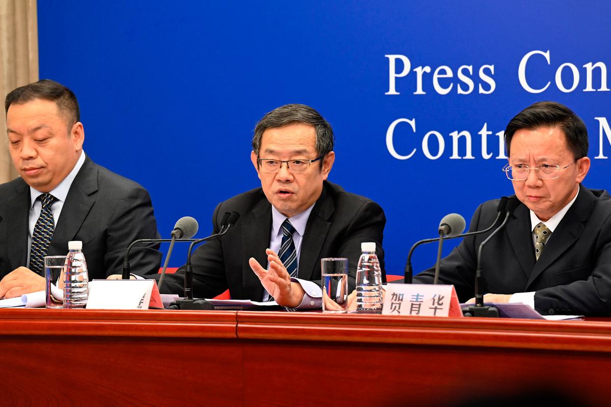 Feng Zijian (C), deputy director general of the Chinese Center for Disease Control and Prevention, answers a question during the press conference of the Joint Prevention and Control Mechanism of the State Council in Beijing on July 31, 2021. (Jade Gao/AFP via Getty Images)