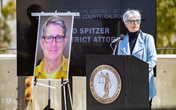 A photo of newspaper editor Gene Harbrecht who was killed by street racers sits on display as his wife Patt Harbrecht speaks in Santa Ana, Calif., on April 29, 2022. (John Fredricks/The Epoch Times)