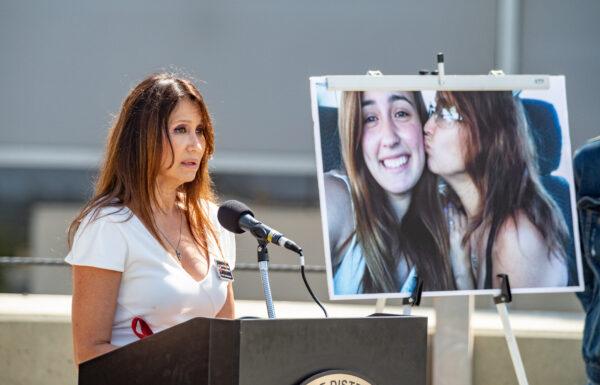 Lili Trujillo speaks against street racing next to a photo of her and her daughter Valentina who was killed in a street racing incident, in Santa Ana, Calif., on April 29, 2022. (John Fredricks/The Epoch Times)