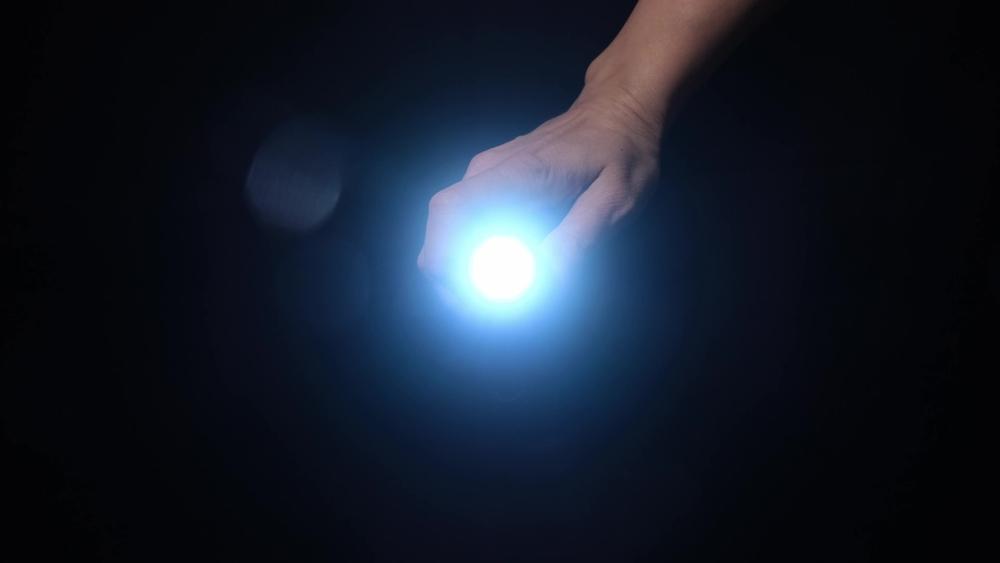 A small flashlight can be a lifesaver if you need to get down a dark staircase after the power goes out. Look for one that offers a strobe mode that can disorient potential attackers. (ReaLiia/Shutterstock)