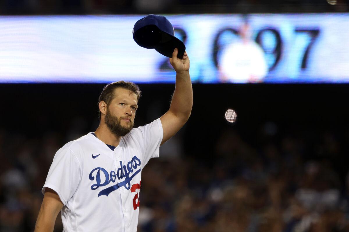Clayton Kershaw #22 of the Los Angeles Dodgers raises his hat to acknowledge the crowd after becoming the Los Angeles Dodgers All-Time Strikeout Leader during the fourth inning against the Detroit Tigers at Dodger Stadium in Los Angeles, on April 30, 2022. (Katelyn Mulcahy/Getty Images)