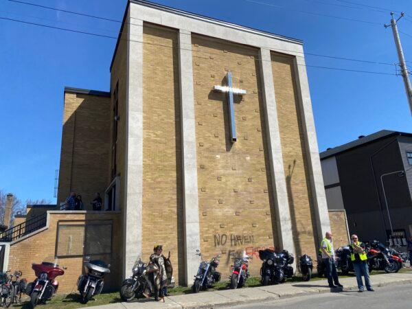 Participants of the Rolling Thunder motorcycle convoy attend a church service at the Capital City Bikers Church in Vanier, a neighbourhood east of downtown Ottawa, on May 1, 2022. Police is investigating acts of vandalism targeting the church, which was found spray-painted with vulgar graffiti that morning. (Limin Zhou/The Epoch Times)