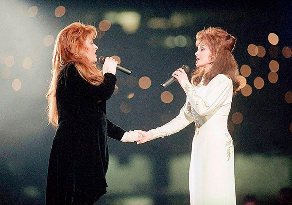 Wynonna Judd (L) and her mother Naomi Judd of The Judds perform during the halftime show at Super Bowl XXVIII in Atlanta on Jan. 30, 1994. (Eric Draper/AP Photo)