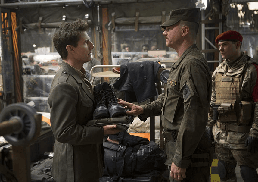 Major Bill Cage (Tom Cruise, L) is given marching orders by Master Sergeant Farell (Bill Paxton), in "Edge of Tomorrow." (Warner Bros. Pictures)