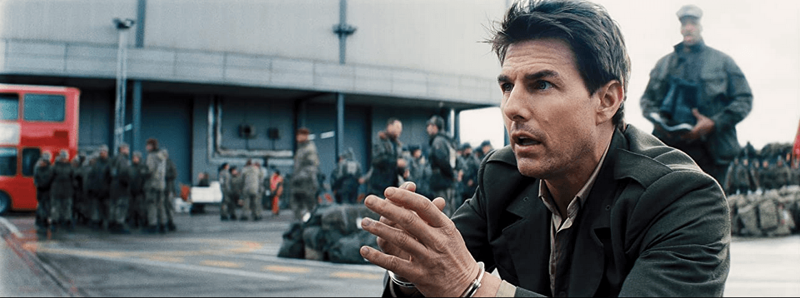 Maj. Bill Cage (Tom Cruise) finds himself in handcuffs and being hustled off to war, in "Edge of Tomorrow." (Warner Bros. Pictures)