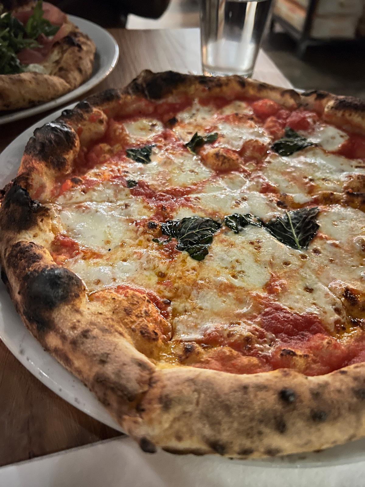 Wood-fired, sourdough-based Neapolitan-style pizza is the specialty of A Dopo. The mozzarella is handmade, too, as seen here in the Margherita, a bubbly concoction full of flavor that includes basil and olive oil. (Mary Ann Anderson/TNS)