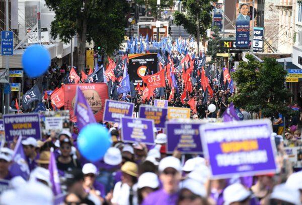 Union members and their supporters take part in the 2021 Labour Day March in Brisbane, Australia, on May 3, 2021. (AAP Image/Dan Peled)
