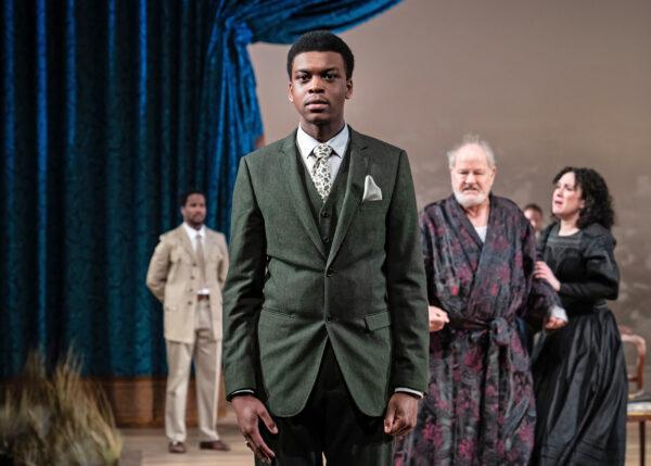 Young Bertram (Dante Jemmott, C) rejects a royal decree, as Helen (Alejandra Escalante) holds back the incensed King of France (Francis Guinan, R), and Rinaldo (Joseph Aaron Johnson, L) looks on, in “All’s Well That Ends Well.” (Liz Lauren)