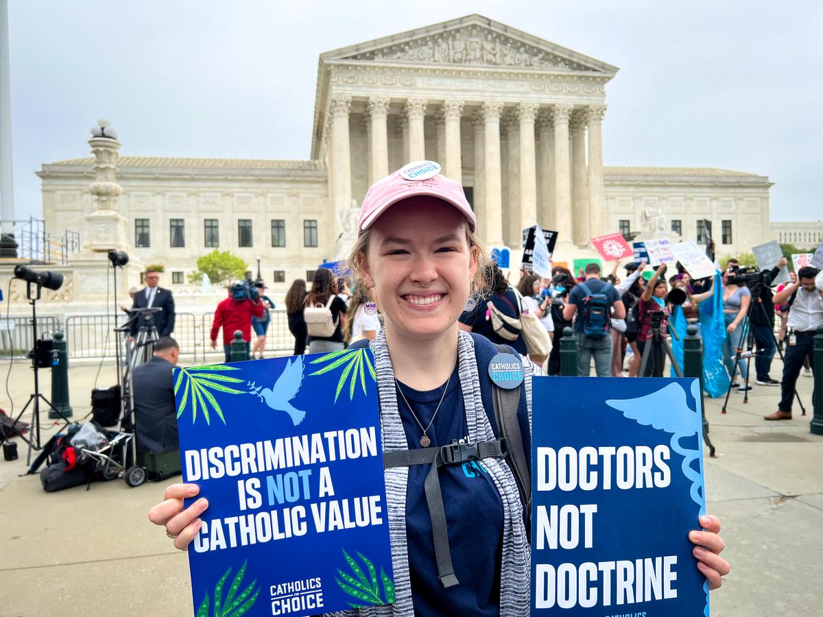 Kate Hoeting, a member of Catholics for Choice, a nonprofit organization that advocates for abortion rights protests the court ruling outside of the Supreme Court building in Washington, on May 3, 2022. (Emel Akan/The Epoch Times)