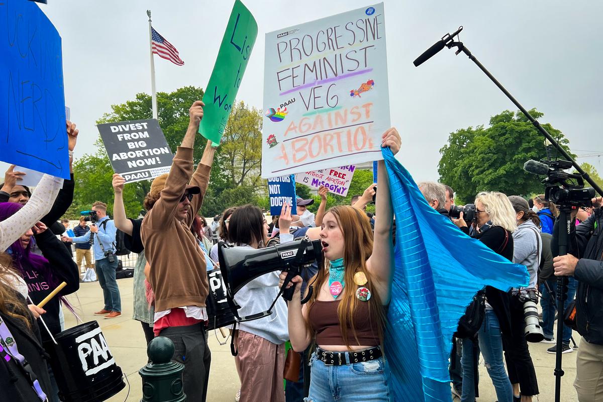 Kristen Turner, communications director for the group called “Progressive Anti-Abortion Uprising” during the protests outside of the Supreme Court building in Washington, on May 3, 2022. (Emel Akan/The Epoch Times)