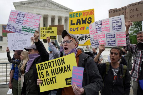 Pro-abortion activists protest in response to the leaked Supreme Court draft decision to overturn Roe v. Wade in front of the U.S. Supreme Court in Washington, on May 3, 2022. (Alex Wong/Getty Images)