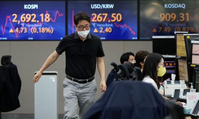 Asian Shares Mixed as Australia Hikes Interest Rate