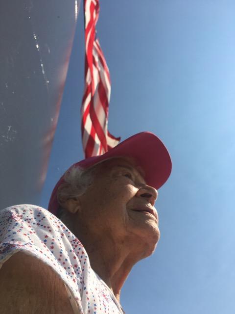 Norma standing next to the 400-foot-tall American Flag in Sheboygan, Wisconsin. Visiting this place was Norma's "favorite thing" on the tour, according to Teresa. (Courtesy of Teresa McFarland)