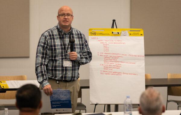 Andrew Cruthers of the Orange County Sheriff's Department Information Technology divsion speaks to attendees of an Orange County Cyber Security seminar in Santa Ana, Calif., on May 4, 2022. (John Fredricks/The Epoch Times)