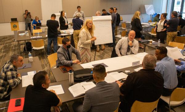 Attendees including emergency, civic, and rescue first responders partake in a cyber security seminar in Santa Ana, Calif., on May 4, 2022. (John Fredricks/The Epoch Times)