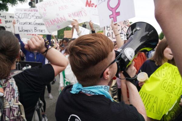 Pro-life group Rehumanize International's executive director Herb Gerhahgty (center) leads a chant at pro-abortion protestors before the U.S. Supreme Court in Washington, D.C., on May 4, 2022. (Jackson Elliott/The Epoch Times)