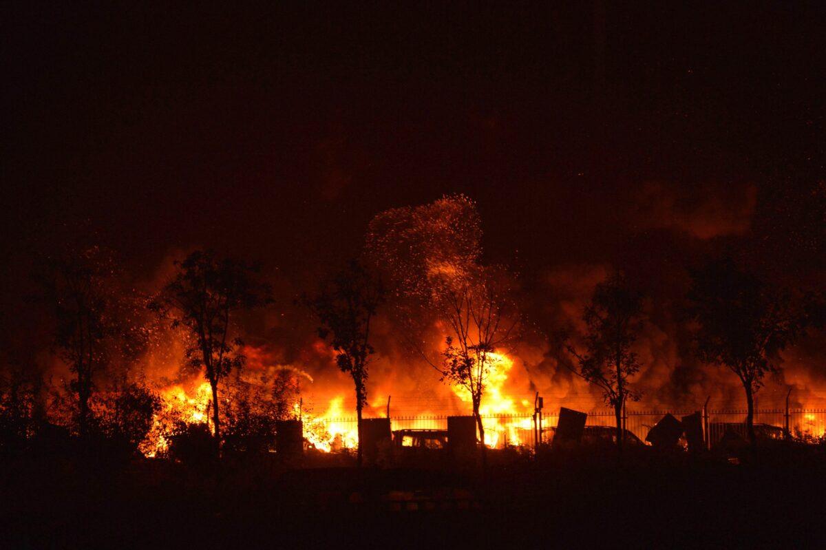 Flames and smoke rise from the site of a series of explosions in Tianjin early on Aug. 13, 2015. (AFP via Getty Images)