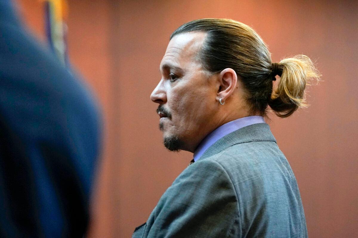 Actor Johnny Depp stands in the courtroom at the Fairfax County Circuit Court in Fairfax, Va., on May 4, 2022. (Elizabeth Frantz/Pool Photo via AP)