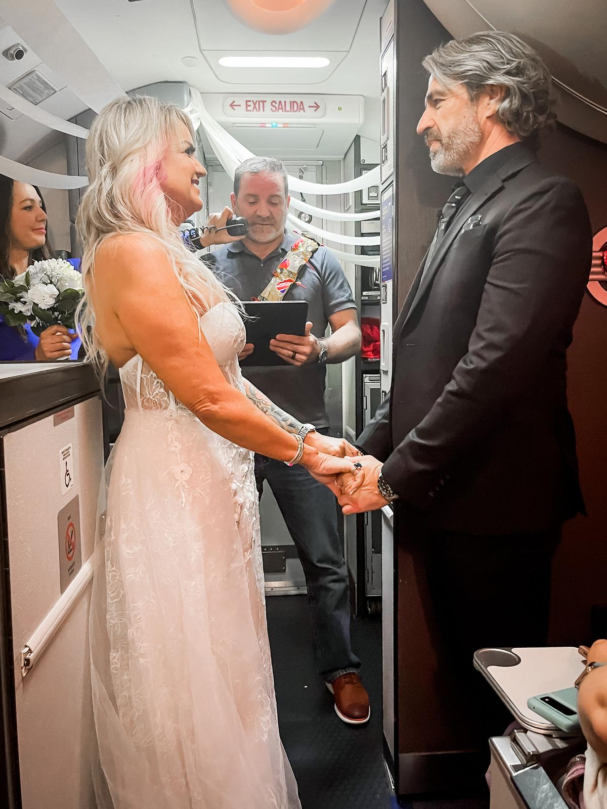 Pam and Jeremy say their wedding vows. (Courtesy of Kaitlyn Manzer)