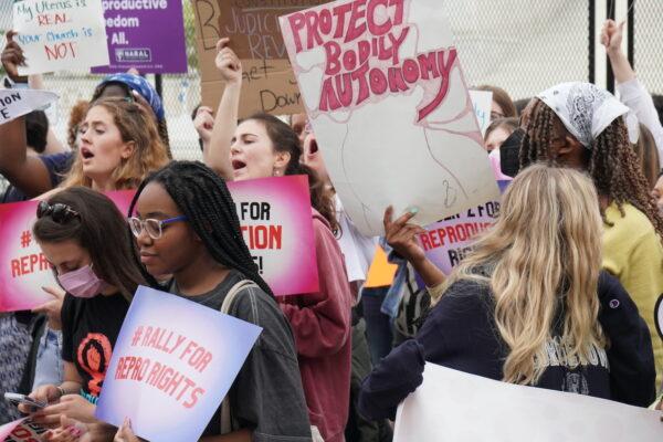 Pro-abortion protesters shout outside the Supreme Court on May 5, 2022. (Jackson Elliott/The Epoch Times)