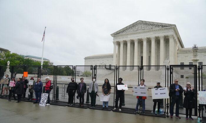 Rain Dampens Turnout at Friday’s Supreme Court Abortion Protest